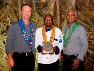 Executive Chef John Moatshe (centre) receives the Blazon award from Chaîne des Rôtisseurs Bailli Kevin Joseph (right) and Vice-Chancelier Philip Mostert (left).