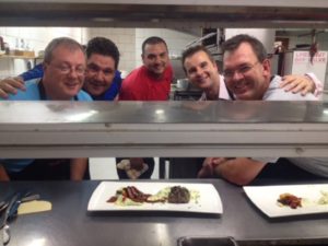 A team of gentlemen with Chef Ryan Brand at the MousterChef competition