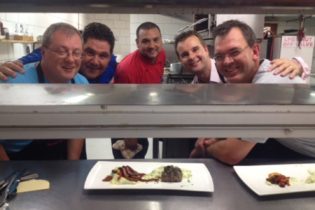 A team of gentlemen with Chef Ryan Brand at the MousterChef competition