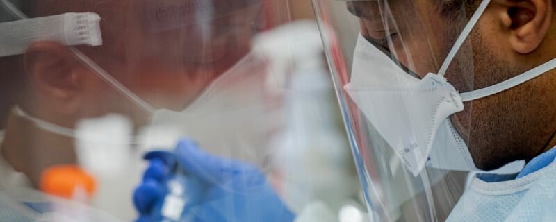 Pennsylvania Commonwealth microbiologist Kerry Pollard performs a manual extraction of the coronavirus inside the extraction lab at the Pennsylvania Department of Health Bureau of Laboratories on Friday, March 6, 2020.