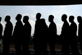 People queuing, in silhouette