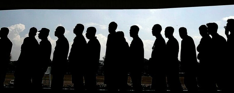 People queuing, in silhouette