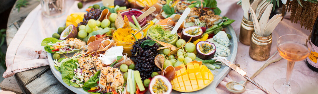 A delicious looking buffet platter full of fresh fruit and vegetables