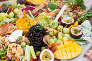 A delicious looking buffet platter full of fresh fruit and vegetables