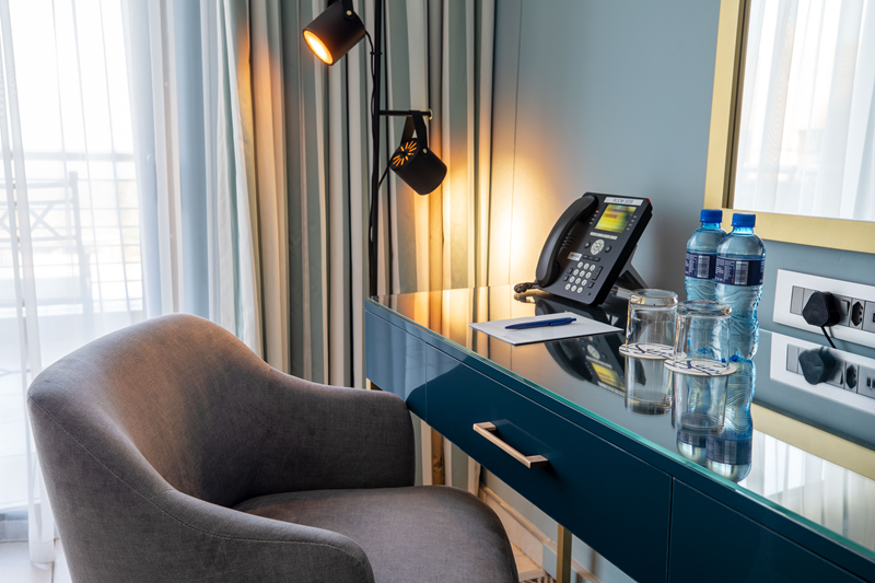 Ample charging points for mobile phones and tablets are provided along with a desk which doubles as a dressing room table